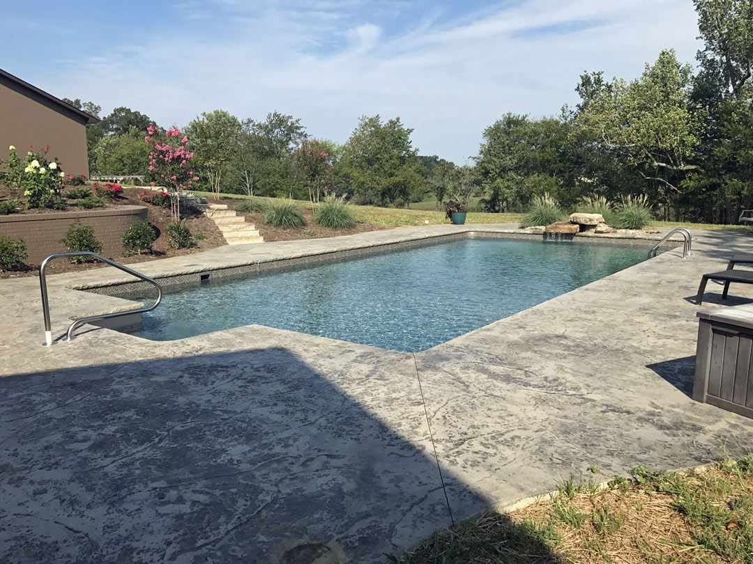 Pool With Beautiful Mature Landscaping Including Decorative Grasses