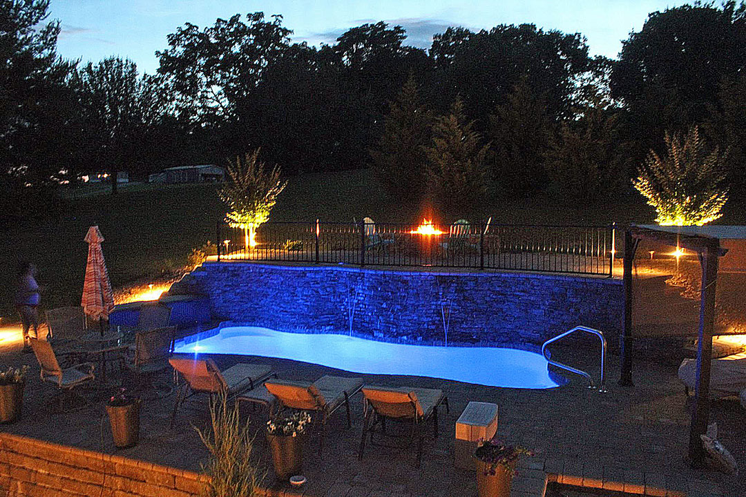 Brilliant Lighting and Fountains in Night Time View of Swimming Pool