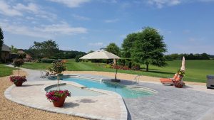 Swimming Pool In Huge Yard With Stunning Plantings Surrounding