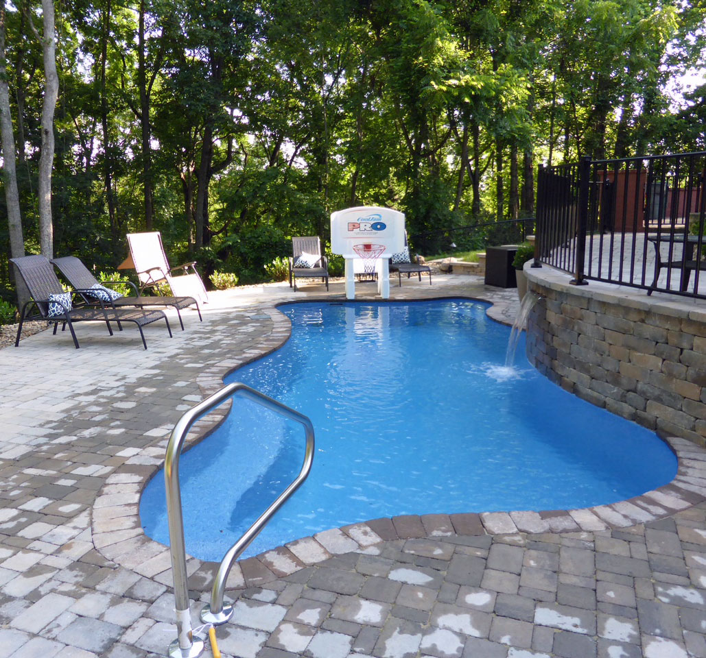 Fun Backyard Pool with Kids Toys and Waterfall Feature