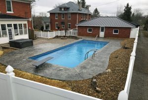 Downtown Johnson City Tennessee backyard lap pool with diving board and stair entry