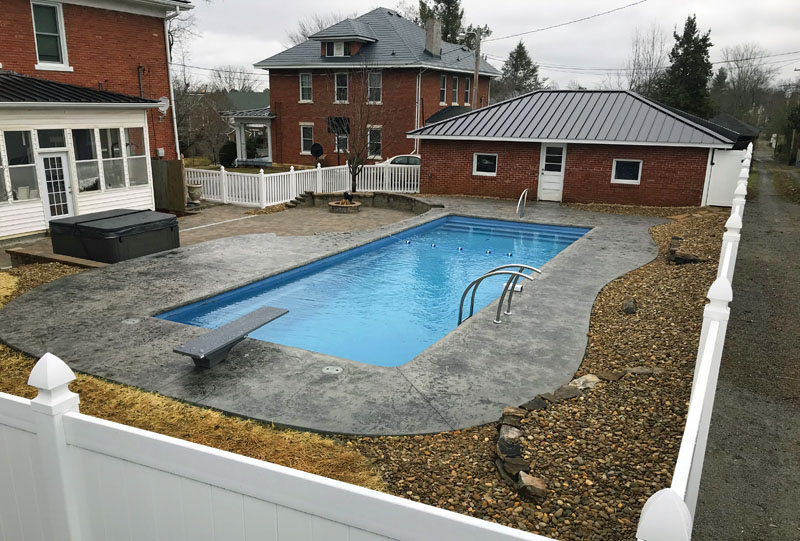 Downtown Johnson City Tennessee backyard lap pool with diving board and stair entry