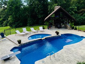 Double level pool with pavilion for entertaining