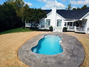 Fiberglass lagoon shape pool just a step off the deck