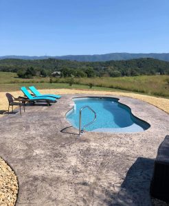 Fiberglass pool on a Tennessee hilltop overlooking the Blue Ridge Mountains in the distrance