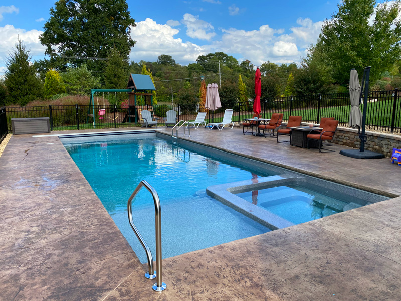 Inground pool and hot tub combo fiberglass unit at a Johnson City, TN house