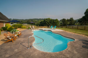 Nestled alongside a field of waterflowers is a lagoon pool radiating serene Caribbean water colors