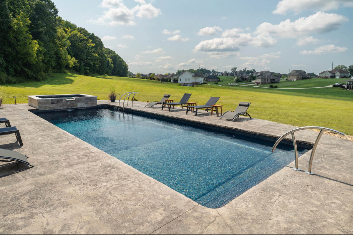 Swimming pool surrounded by textured concrete non-slip decking