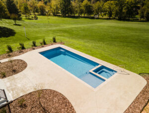Simple backyard pool install feels quite modern with integrated soaker tub in Greeneville, TN