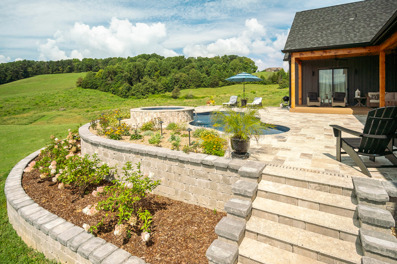 Pool decking level with house back patio on multi-level terracing